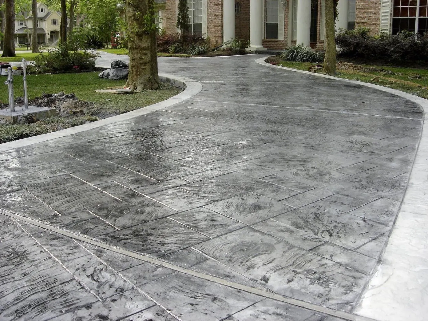 Decorative stamped concrete drive and pool decking