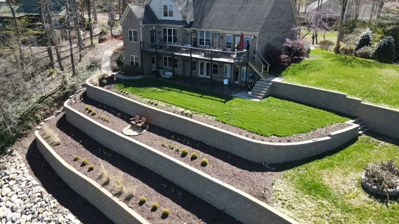 Three-tier lakefront retaining wall with planted terraces in Mooresville